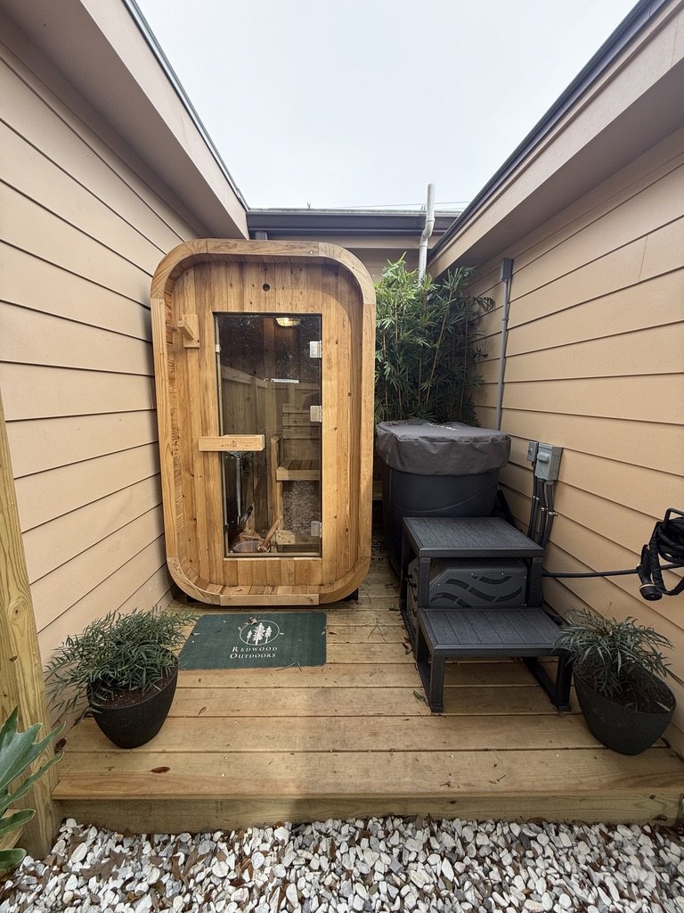 The outdoor cedar sauna and cold plunge tub in the recovery area at Fitz Fitness, Johns Island SC