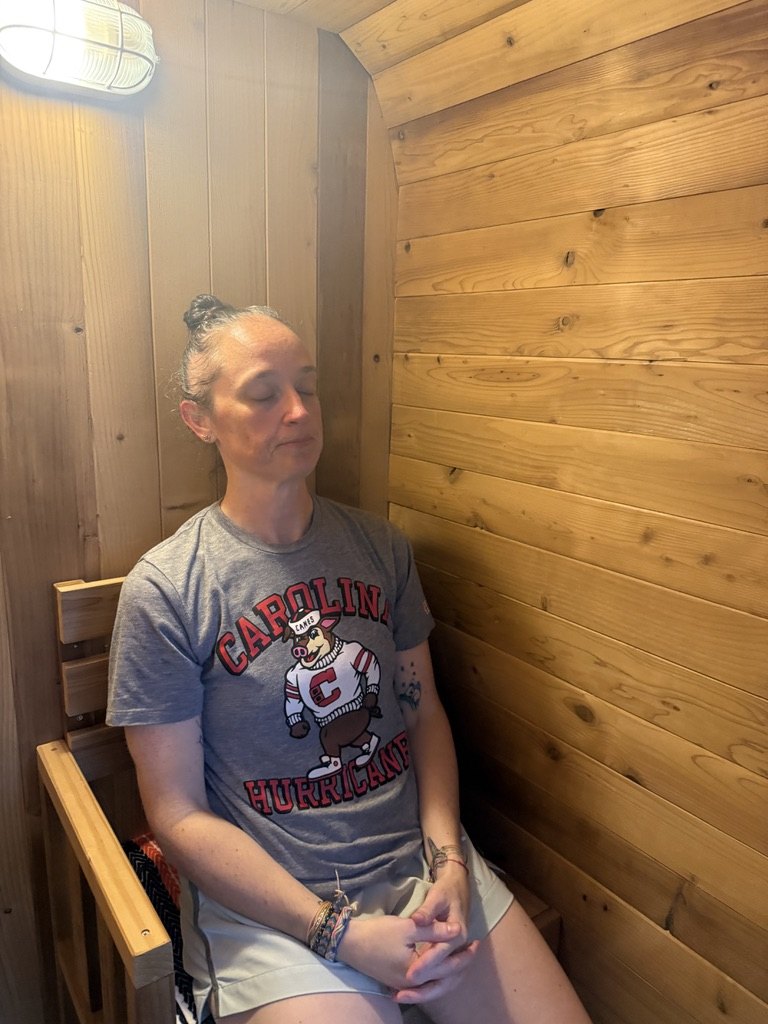 A client relaxing inside the cedar sauna at Fitz Fitness on Johns Island